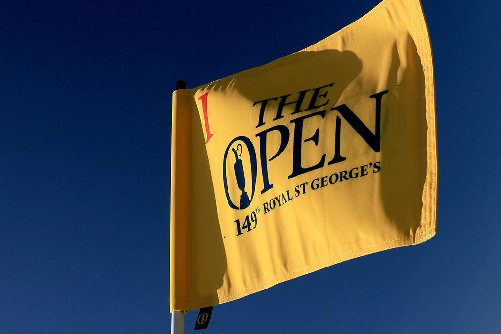 The Open pin flag on the first green at Royal St George